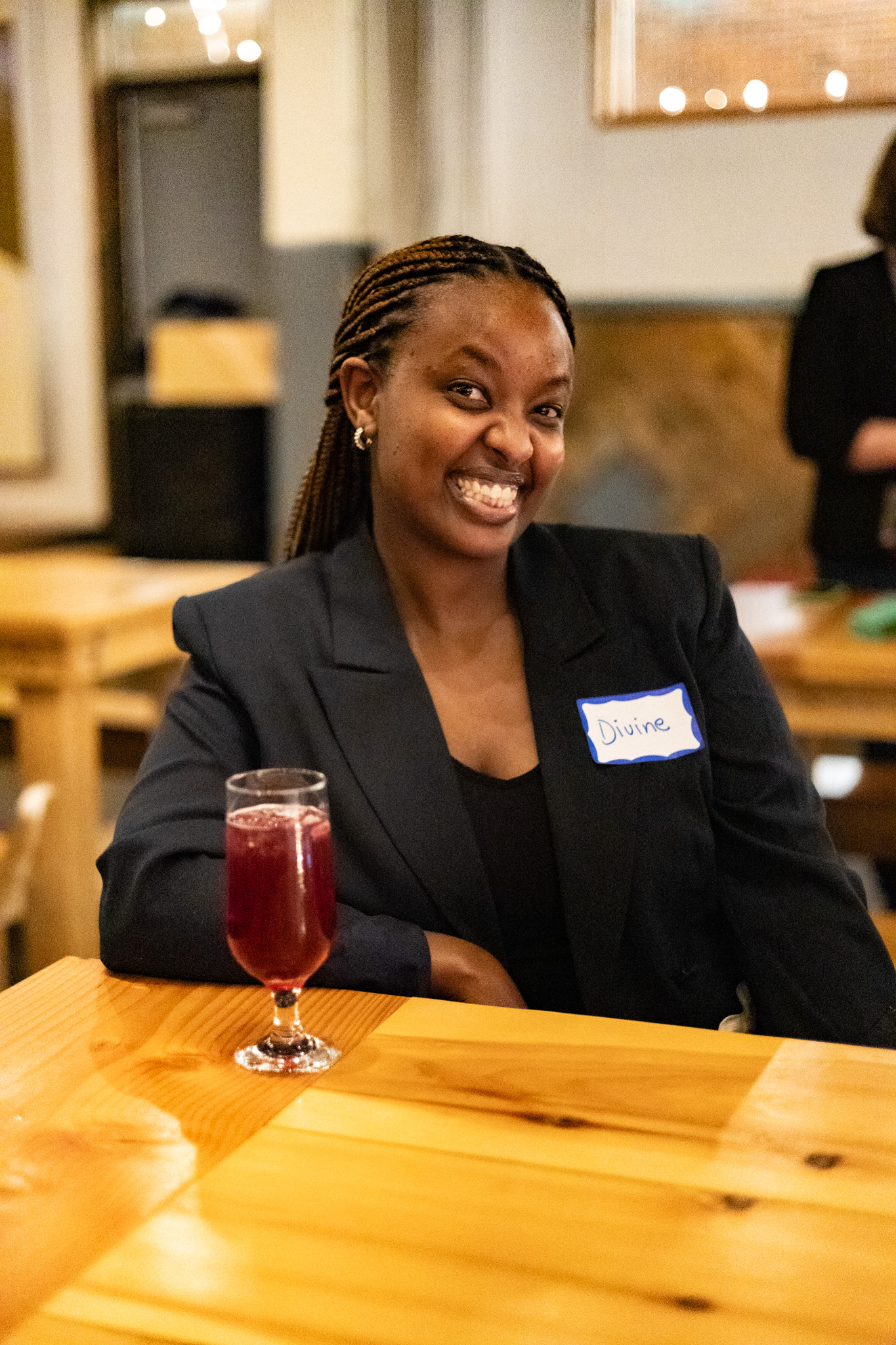 A participant smiling at a table
